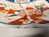 a plate with a design on it sitting on a table