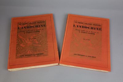 two books sitting on top of a table next to each other