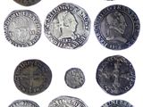 an image of a collection of silver coins on a white background
