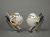 pair of silver and white art deco lamps on marble bases