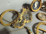 many different pieces of jewelry that are on the table