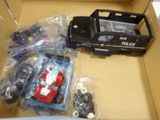 a box with a toy truck and other toys in it