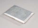 silver plated business card case on a white surface