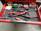 a red tool box with many tools in it
