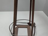 an image of a table with a lamp on top of it on a white surface