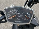 a close up of a motorcycle with a speedometer on it
