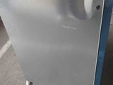 a silver dishwasher that is sitting on the floor