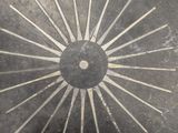 a black and white picture of a clock on the wall