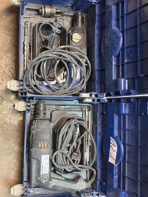 two blue boxes with wires in them on the floor