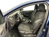 the interior of a car with the door open and the driver ' s seat down
