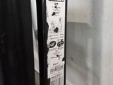a close up of a door handle with a sticker on it