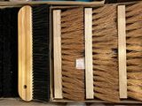 a lot of brushes that are sitting in a box