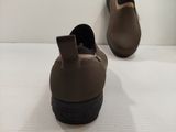 they are two pairs of brown shoes on a white surface