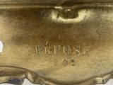 an image of a close up of a metal object on a white surface