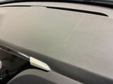 a close up of the dashboard of a car with the sunroof