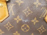 a close up of a brown louis vuitton bag