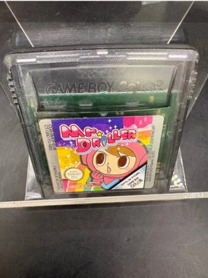 a gameboy game in a plastic case on a table