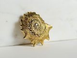 gold plated flower brooch with crystal center