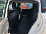 a white car with black seats in the back of it
