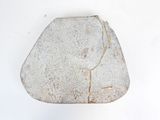 a rock that has been placed on a white surface