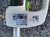 a close up of a white handle with a barcode on it