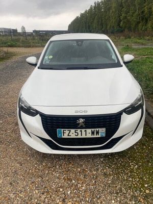a white car parked on the side of the road