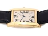 an image of a gold wrist watch with roman numerals on a black leather strap