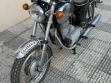 a motorcycle that is parked on the side of the street