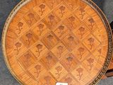an image of a round table with a pattern on the top of it