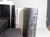 a computer sitting on top of a table next to other electronics