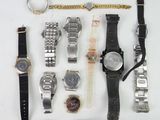 a lot of watches that are laying out on the table