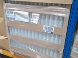 a pallet full of bottles of water sitting on a pallet