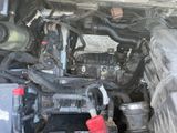 a close up of a car engine with the hood open
