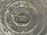 a close up of a metal object with a hole in it
