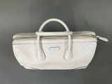 a white handbag with a zipper on the top of it
