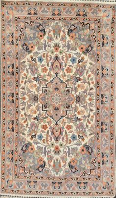 a beige and blue rug with a medallion design on it