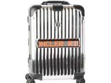 silver and black luggage with orange lettering on wheels on a white background