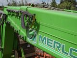 a close up of a green tractor with the word merrlc on it