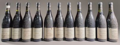six bottles of wine are lined up in a row on a table