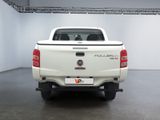a white pick up truck parked inside of a building