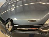 a close up of the front of a car with a badge on it