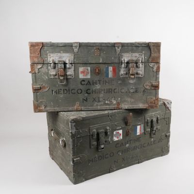 two trunks stacked on top of each other on a white surface