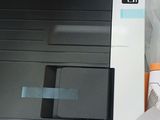 a black and white printer sitting on top of a table