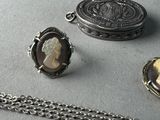 a necklace with a picture of a woman and a locke on it