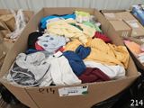 a cardboard box full of clothes sitting on a table
