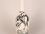 a white vase with a black design on it