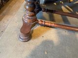 a wooden table with a wooden top and a wooden base