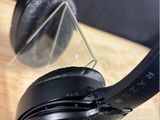 a pair of headphones sitting on a wooden table