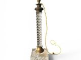 an old fashioned lamp with a rope on top of it