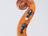 an old violin with a wooden bow on a white background